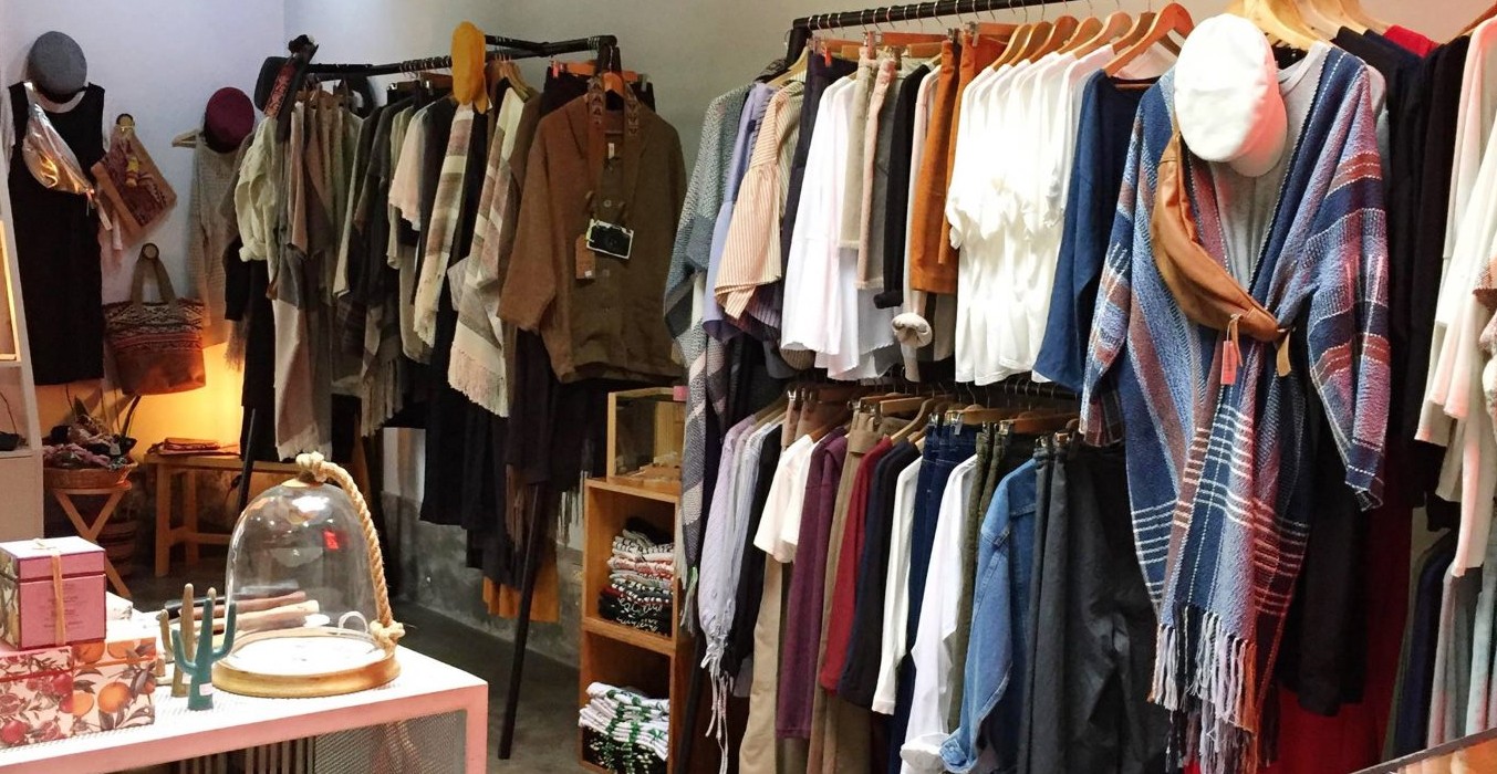 A variety of clothing items on display in a boutique store